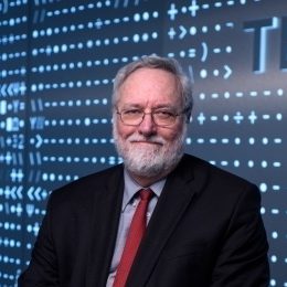 photo of Carl Thompson with blue background