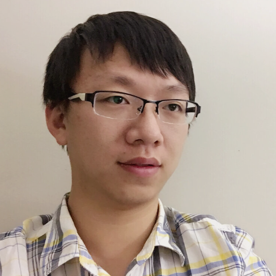 Jinchi Han wearing half frame glasses and a white and grey plaid shirt