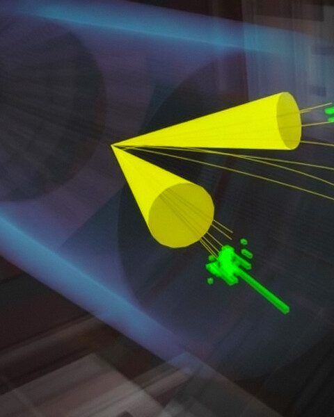 A rendering shows two particles interacting in a vast tube. The particles each create a yellow funnel showing their trajectory.