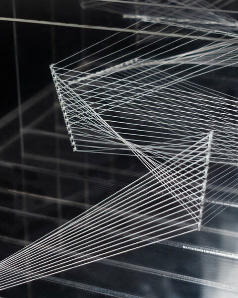 A layered sculpture resembling zig-zag patterns and geometric shapes