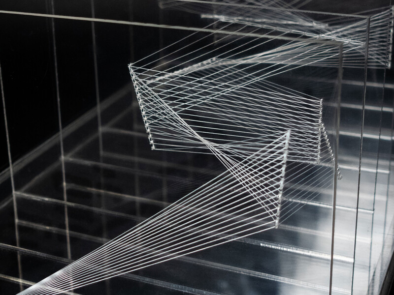 A layered sculpture resembling zig-zag patterns and geometric shapes